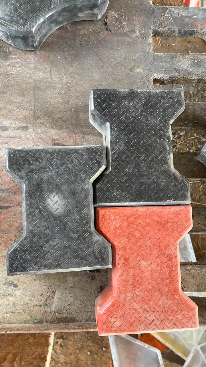 Interlocking paver blocks showing the thick coloured top layer